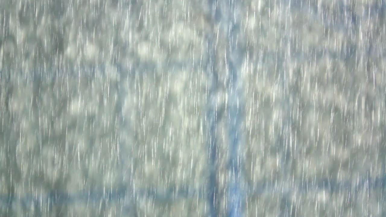 Slow motion rain falling on ground, Close up view