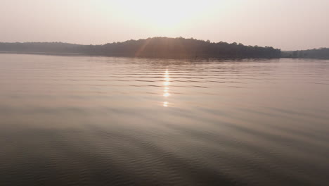 evening boat safari on the tranquil kabini river at dusk, serene and peaceful
