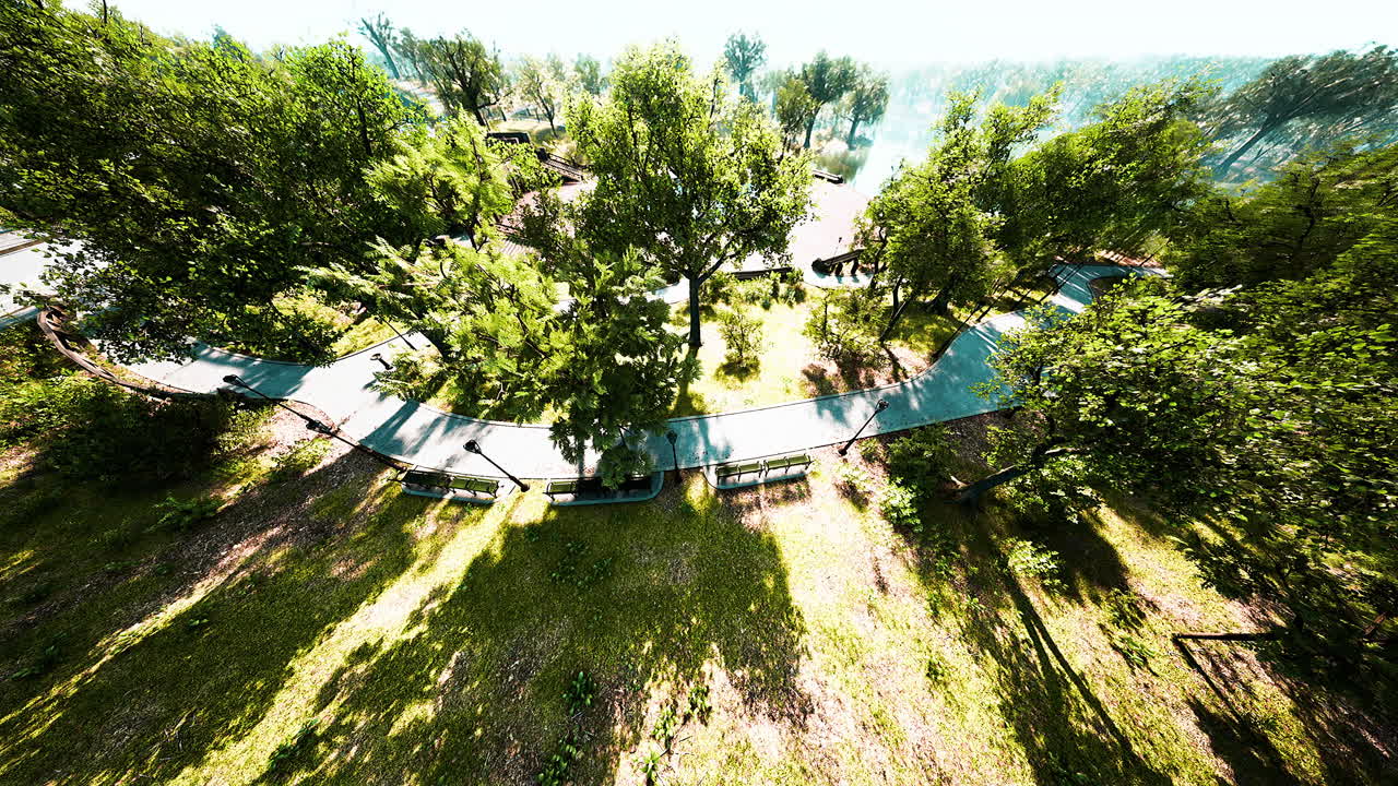 Aerial View of a Serene Park with Winding Paths and Lush Greenery