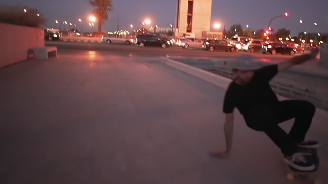Skateboarder in the City at Dusk