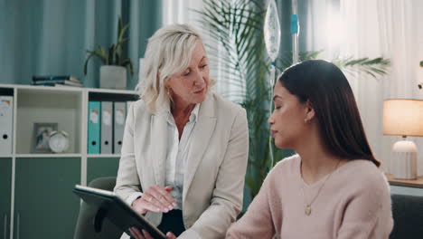 a doctor talking to a patient in an office