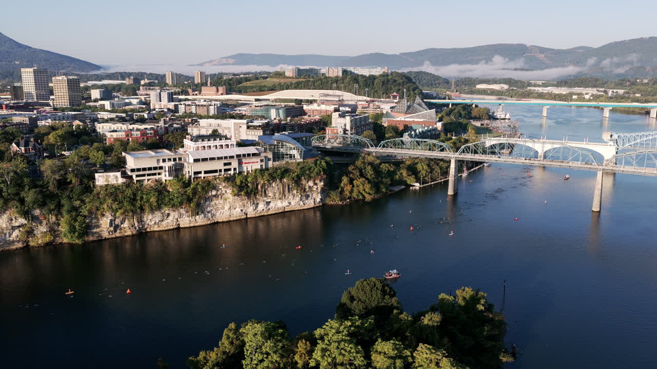 The Tennessee River sparkles as swimmers and kayaks weave between Chattanooga’s bridges with Lookout Mountain in the distance