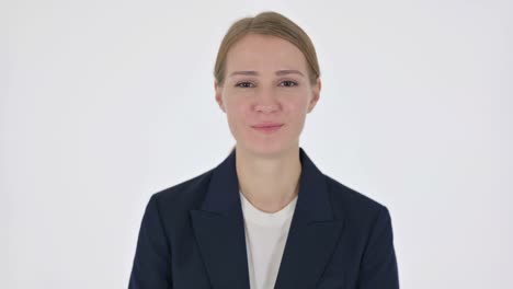 young businesswoman smiling at camera on white background