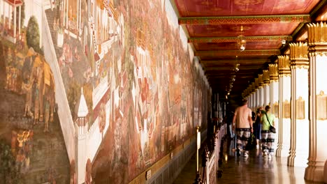 visitors admire intricate wall art in temple