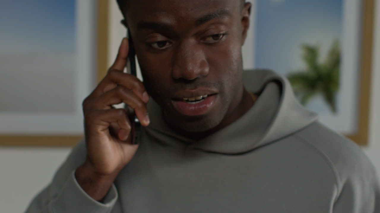 Close Up Of Young Man At Home Talking On Mobile Phone Reacting And Looking Upset After Getting Bad News 5