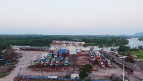 fishing boats at a river port in southeast asia