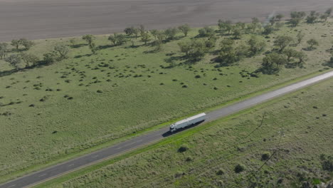drone shot of a road train driving towards moree, new south wales, australia