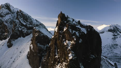 massive rocky mountains, golden hour on the south coast of iceland - aerial view