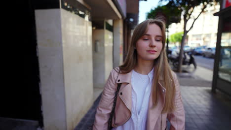 young woman walking in a city
