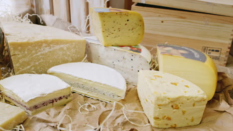 cheese boutique pieces of appetizing cheese of different varieties lie on the counter