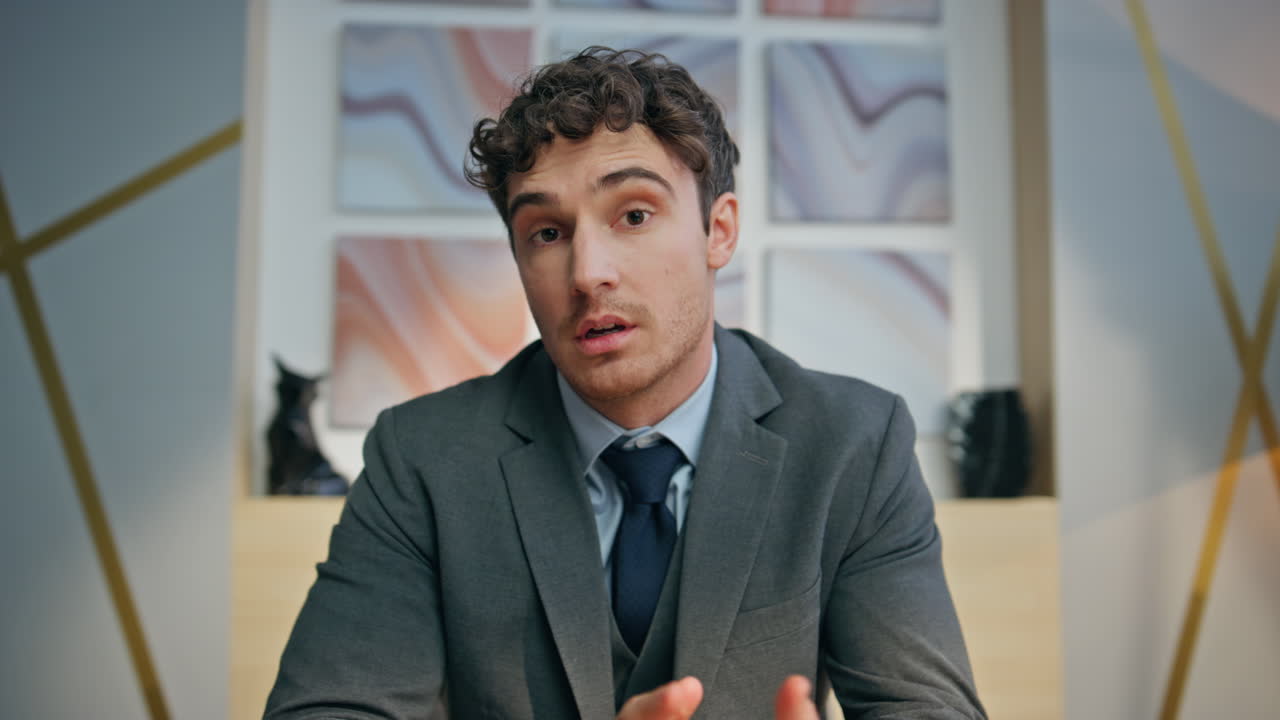 Friendly director chatting online interview at modern interior closeup pov view