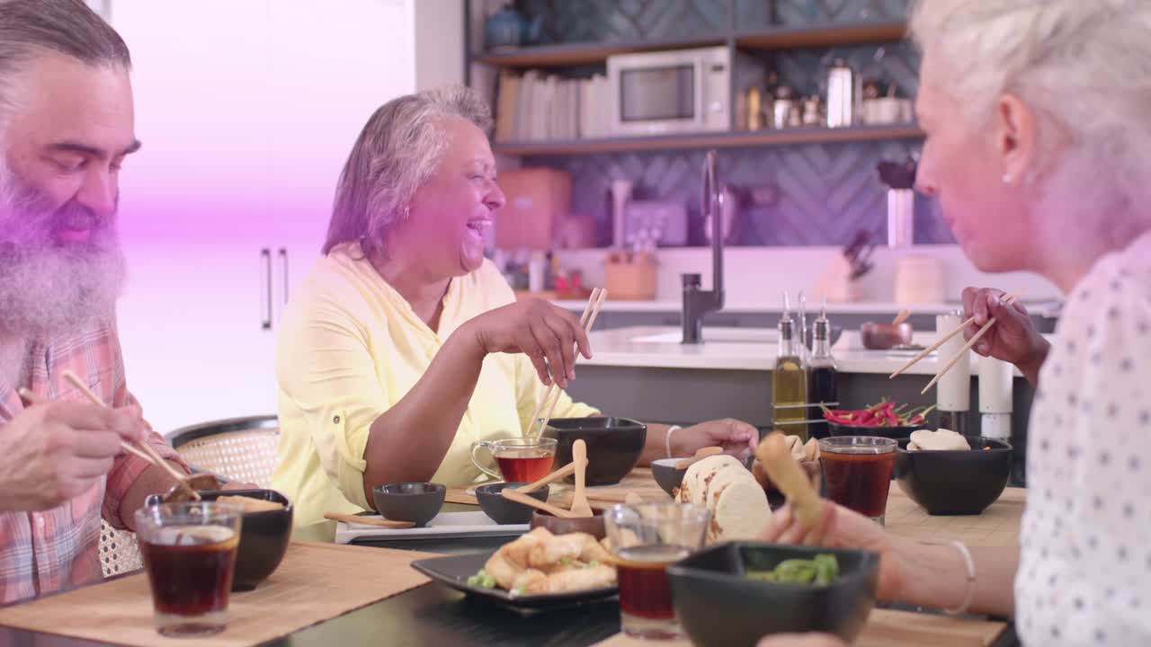 Woman starting chat, waving chopsticks at table as purple streaks sweeping, group sharing food