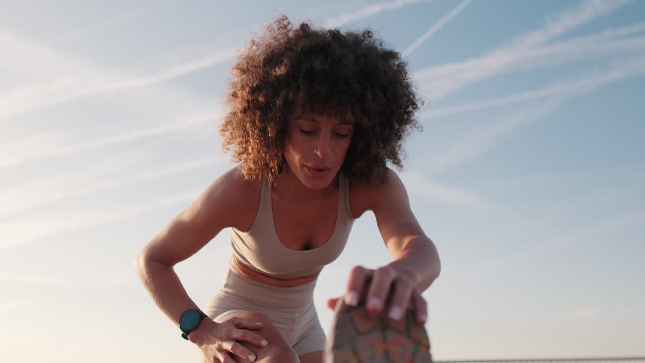 Young Woman Stretching Before Outdoor Workout