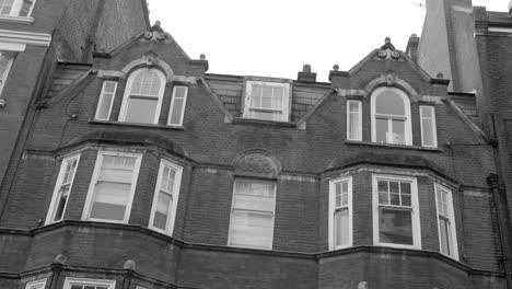 Low-angle-black-and-white-shot-of-Typical-brick-architecture-house