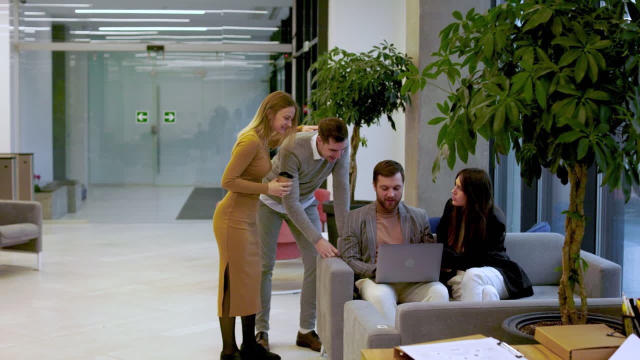 Coworkers talking in the office