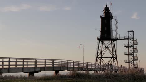 Old-antique-lighthouse-with-metal-stairs-while-sunset-at-the-North-Sea