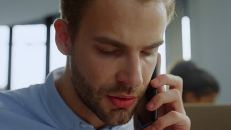 Businessman-having-conversation-on-mobile-phone.-Executive-talking-on-smartphone