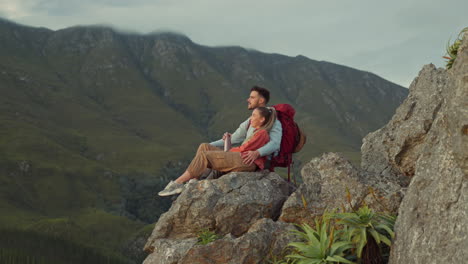 Hiking,-mountain-and-view,-couple-relax-on-outdoor