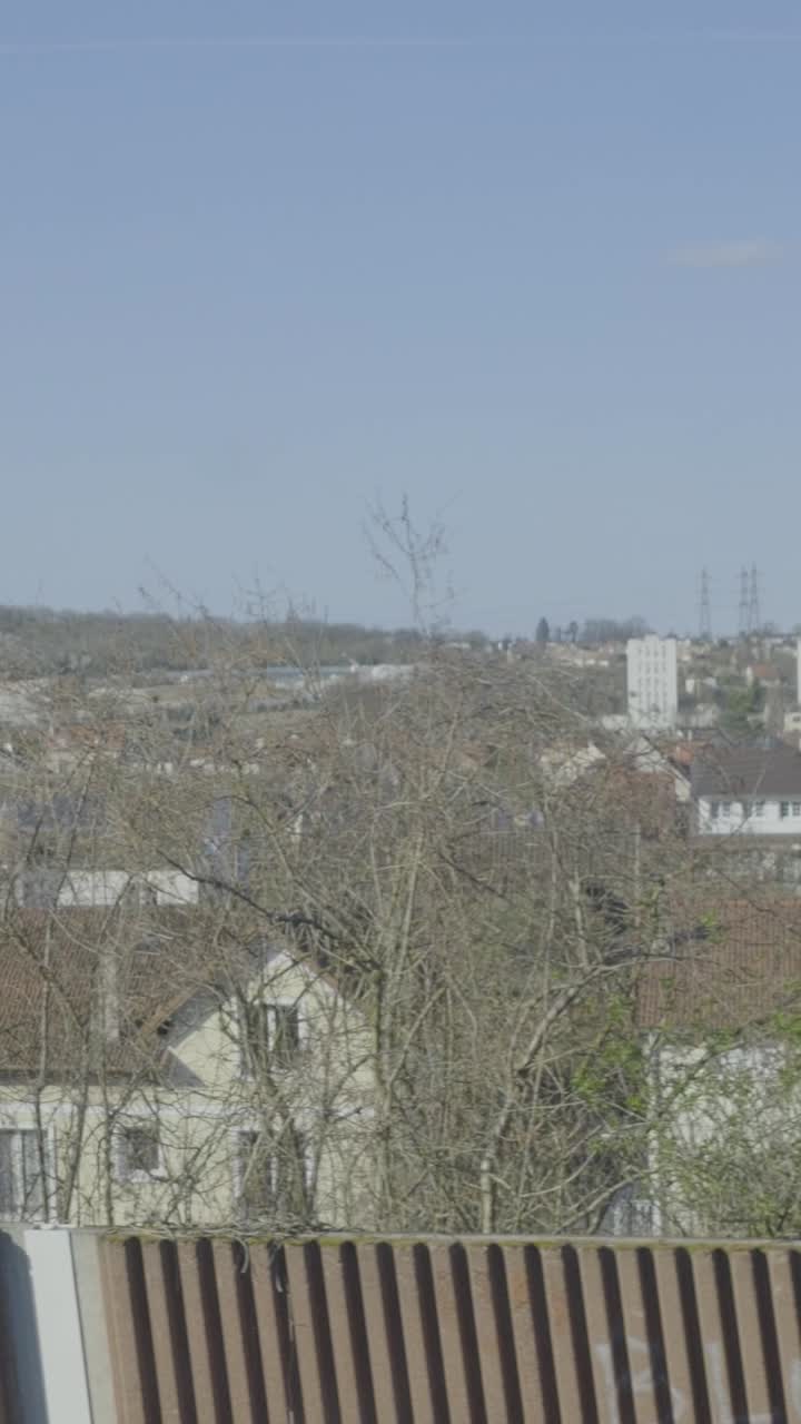 Train POV of passing countryside, focusing on nature and serenity