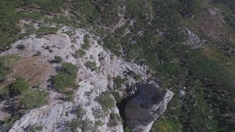 aerial view of mountainous landscape with cliff and valley