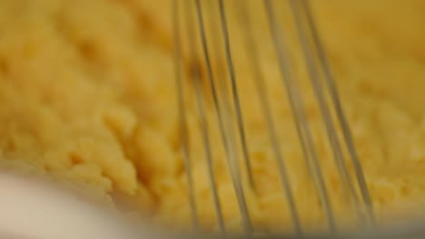 Making-mashed-cassava-from-organically-harvested-roots-from-farms-in-the-Amazon-rainforest---macro-view-of-stirring-it-with-a-whisk