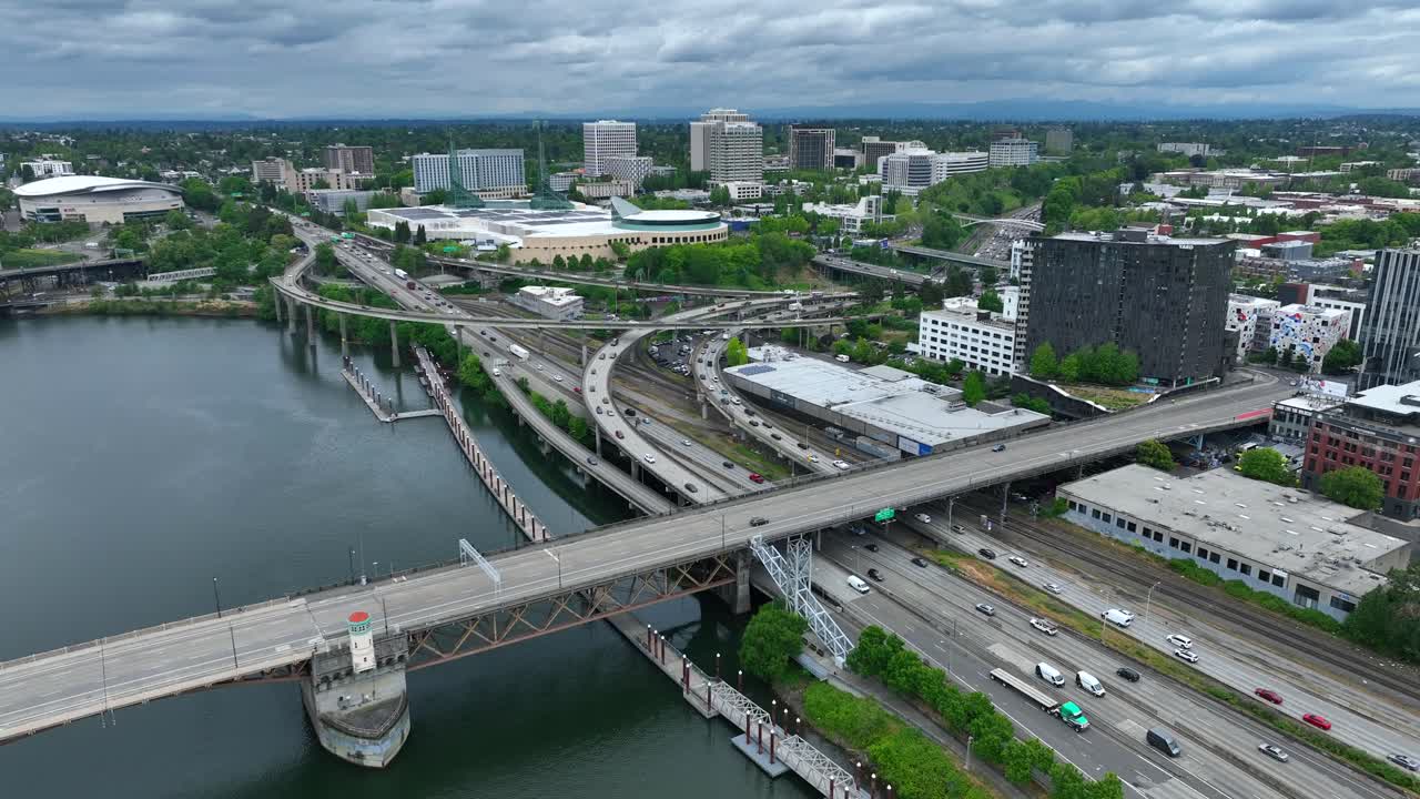 Traffic in Portland Oregon Driving on bridge over river. - Aerial Drone View