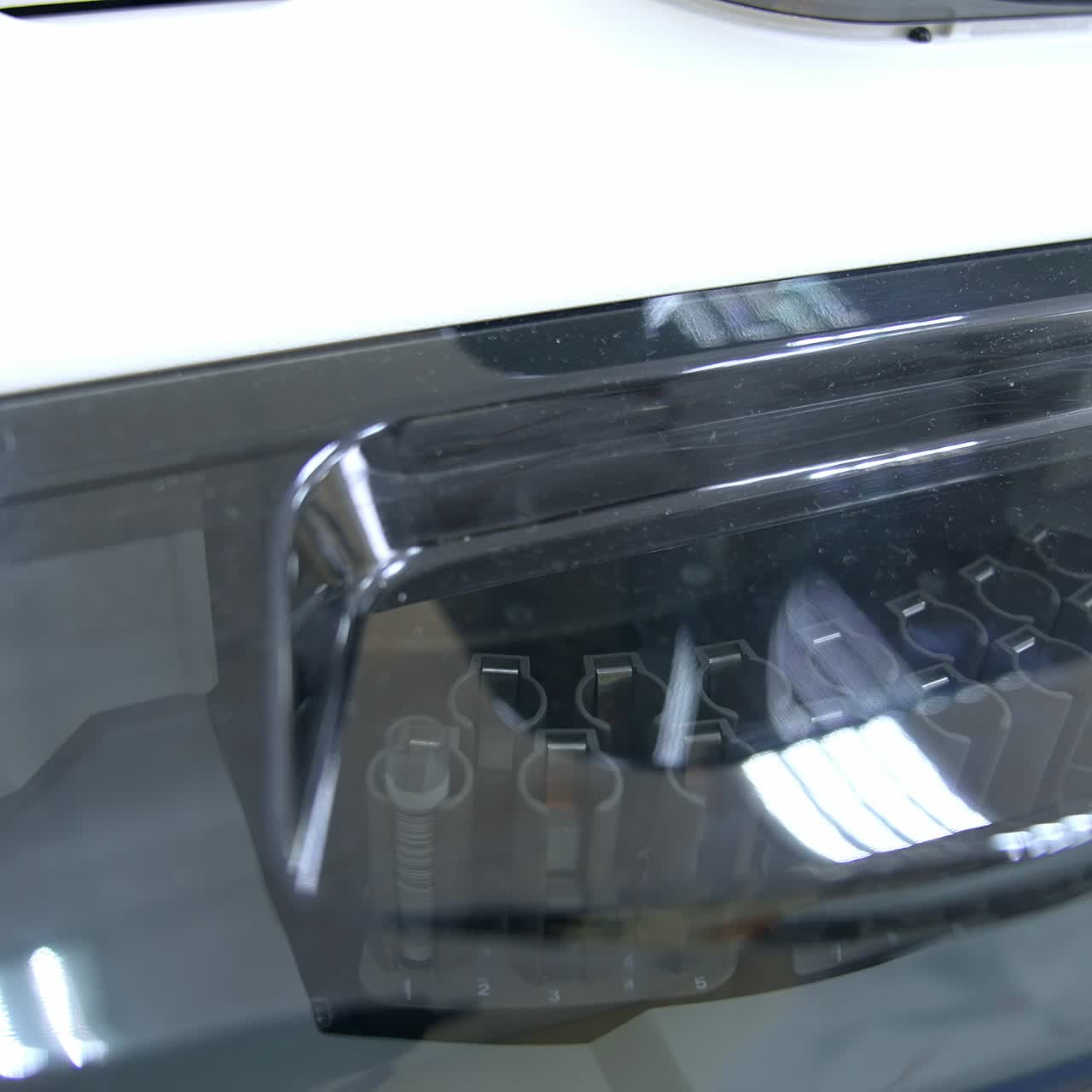 Stand with test tubes moves inside the apparatus. Process of work of biomedical testing equipment in modern science laboratory. Close up