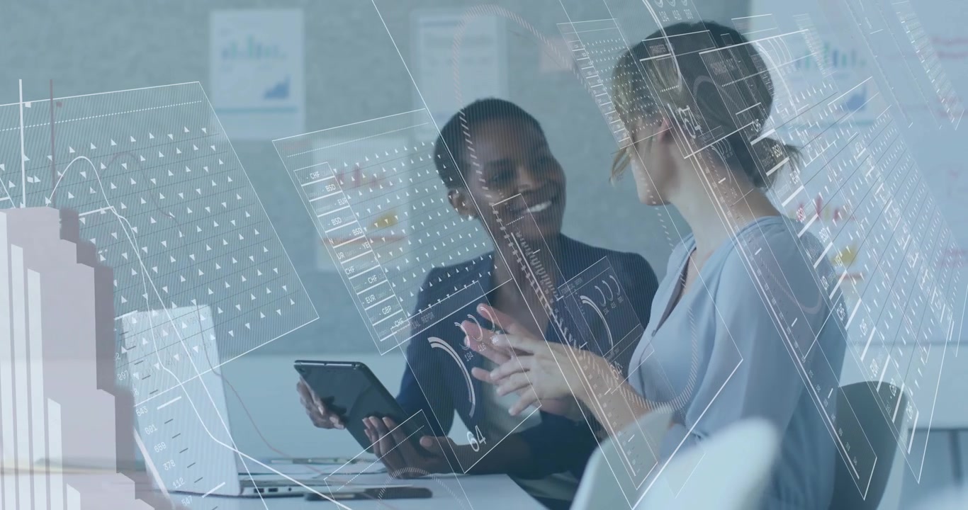 Two Businesswomen Collaborating with Digital Data Overlay in Modern Office