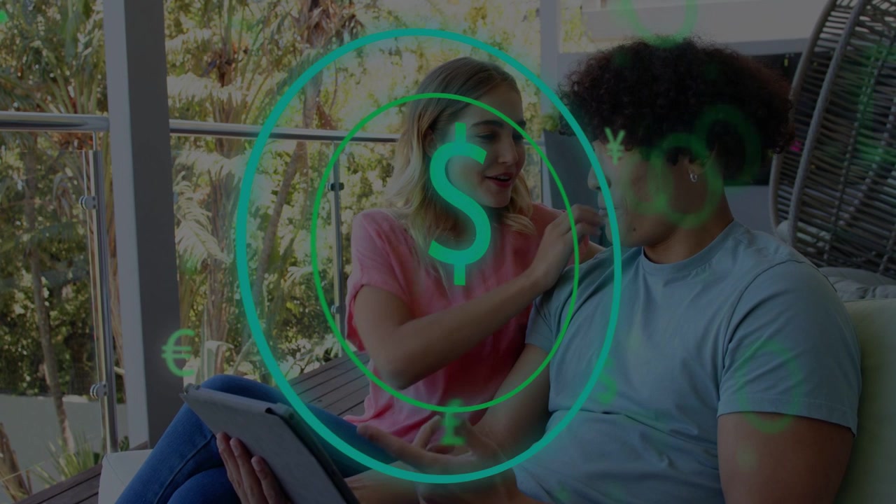Man tapping tablet causing teal coin overlay floating between them while smiling, checking finances