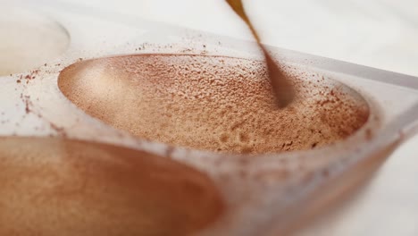 preparing chocolate truffles in a mold