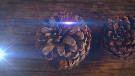 animation of glowing lights moving over fir tree cones christmas decorations