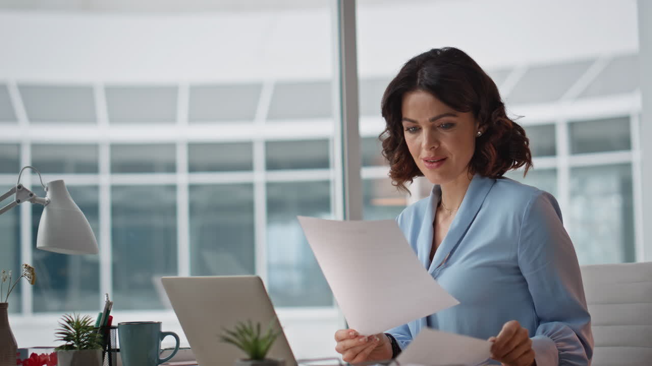 Creative manager planning project at office closeup. Woman reading documents