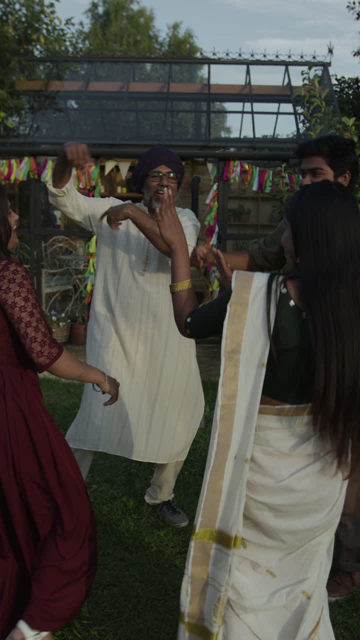Group of people dancing at an outdoor festive celebration