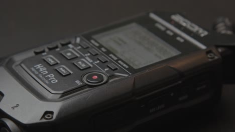 Reporter-starting-audio-recording-of-portable-soundrecorder
