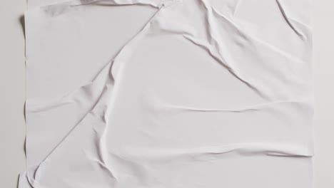 Video-of-close-up-of-white-creased-fabric-with-copy-space