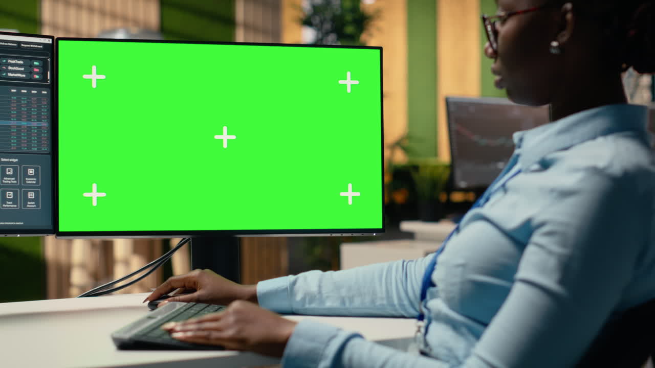 Equity analyst using isolated screen PC to reviews quarterly earnings