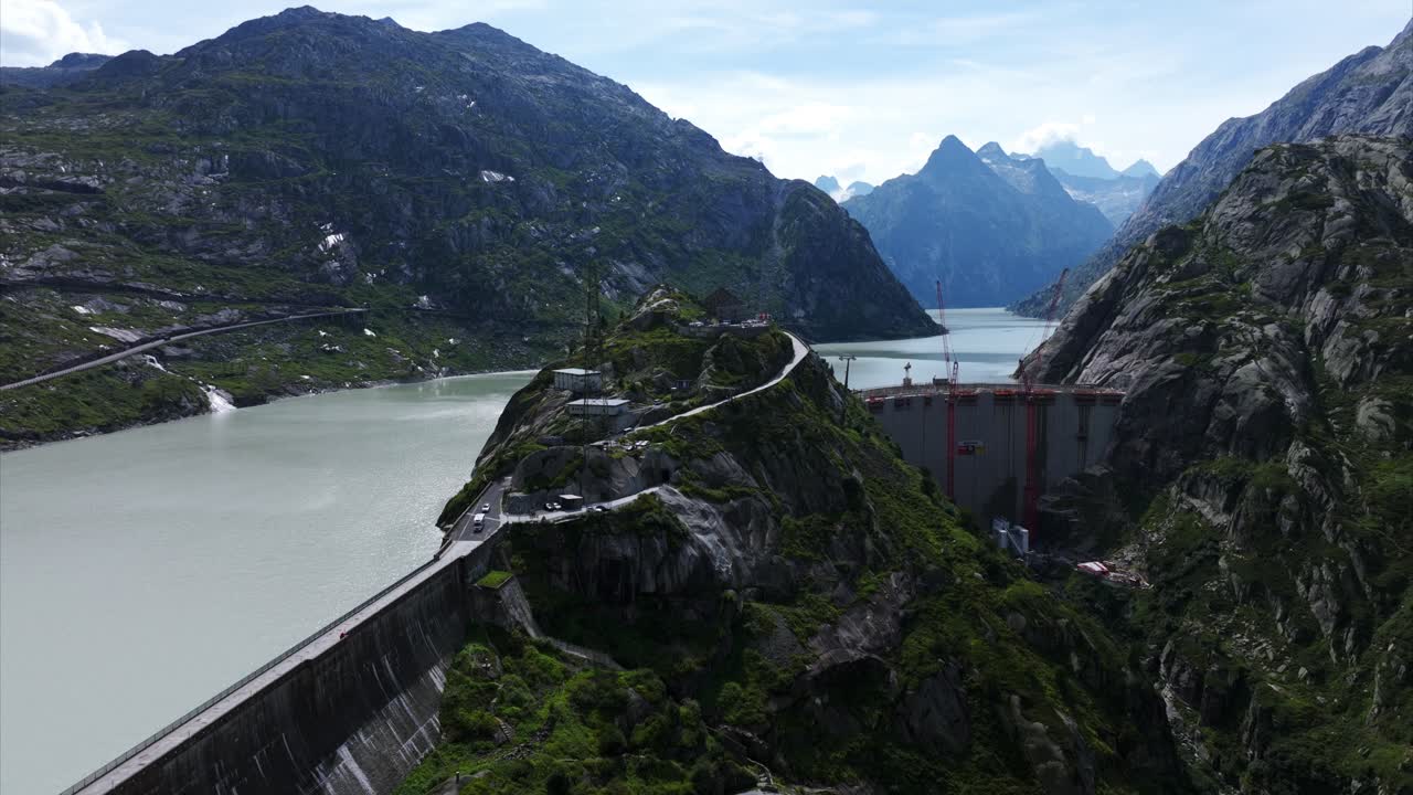 Aerial View of a Dam and Reservoir in the Swiss Alps