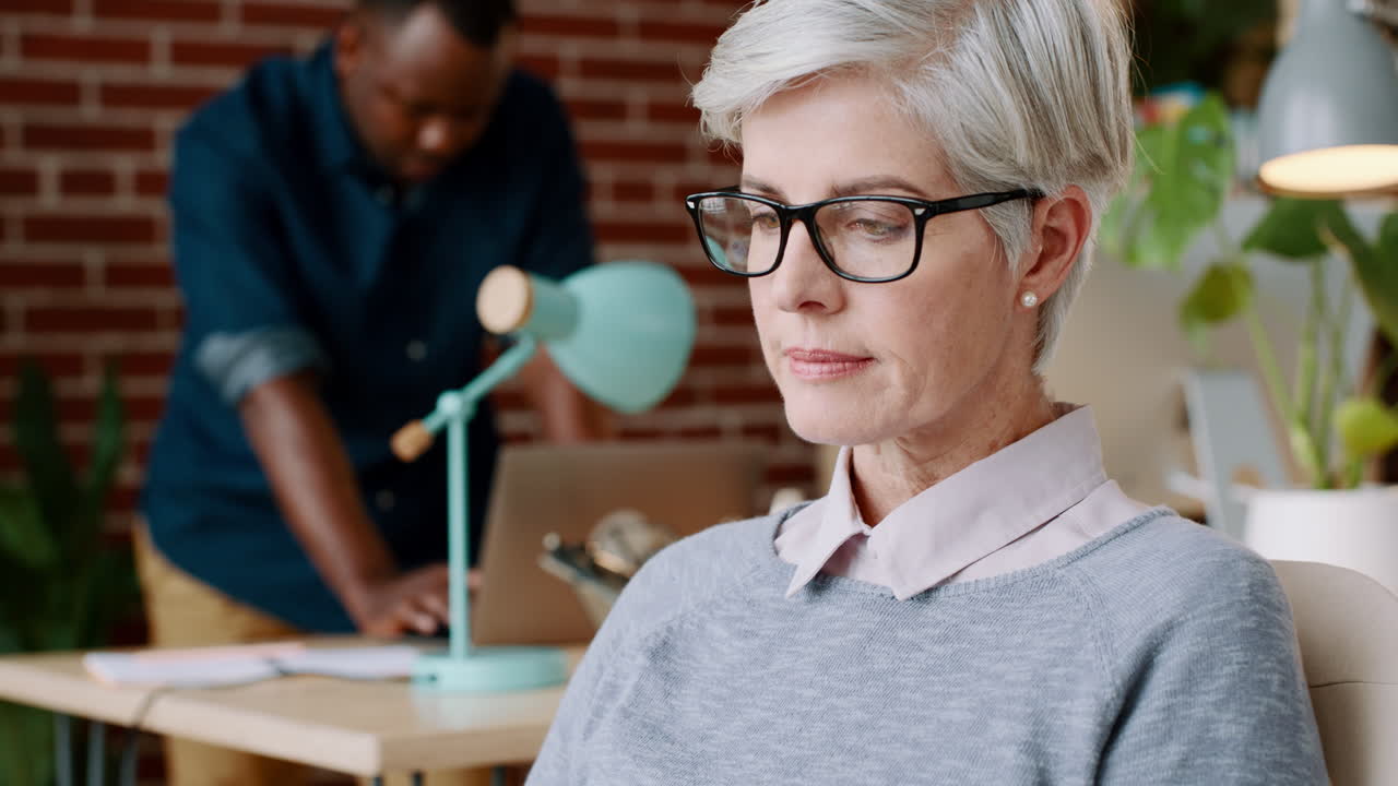 Glasses, reading and senior business woman