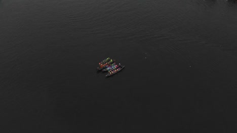 Boats-on-thu-bon-river-at-Hoi-an-old-town-Vietnam-with-laterns,-aerial