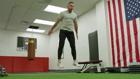 man train on sports training equipment in a fitness gym