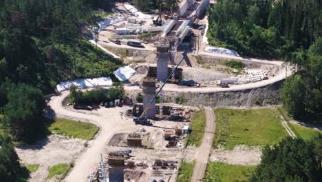 construction site of rail baltica bridge over neris river, aerial view
