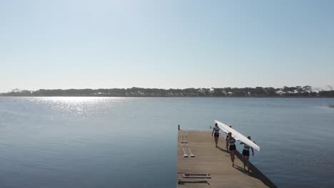 female rowing team training on a river