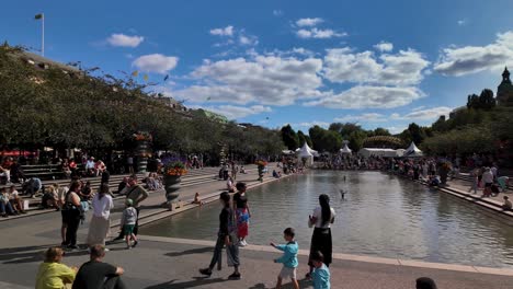 crowded city park on a sunny summer day