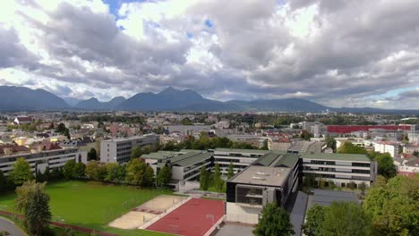 wide dramatic aerial pull in showing outskirts of salzburg in kuchl austria