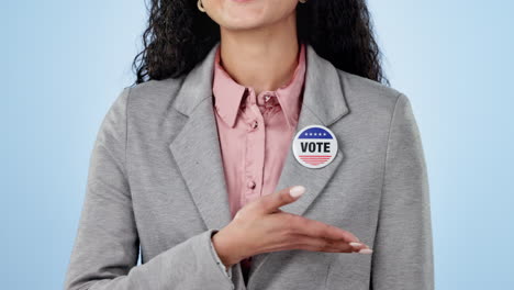 Woman-in-studio-with-pointing-to-vote