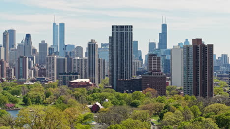 chicago usa residential towers and downtown skyscrapers, drone shot from lincoln park on sunny summer day