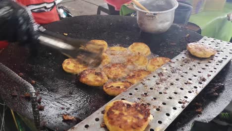 ecuadorian prepares traditional street food recipe fried corn tortilla in traditional market