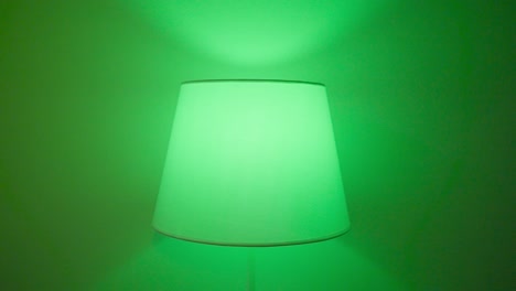 lamp with different colored shades on a wall