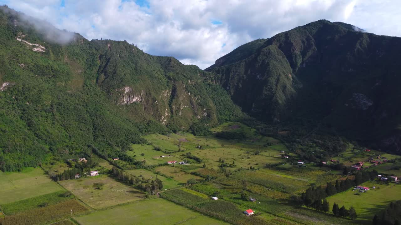 Aerial Drone Dolly-In Over Inhabited Volcano Crater Farmlands in Ecuador