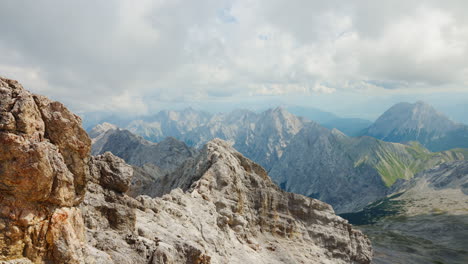 The-magnificent-sight-of-a-mountain-range-accompanied-by-captivating-cloud-formations-and-a-dynamic-sky